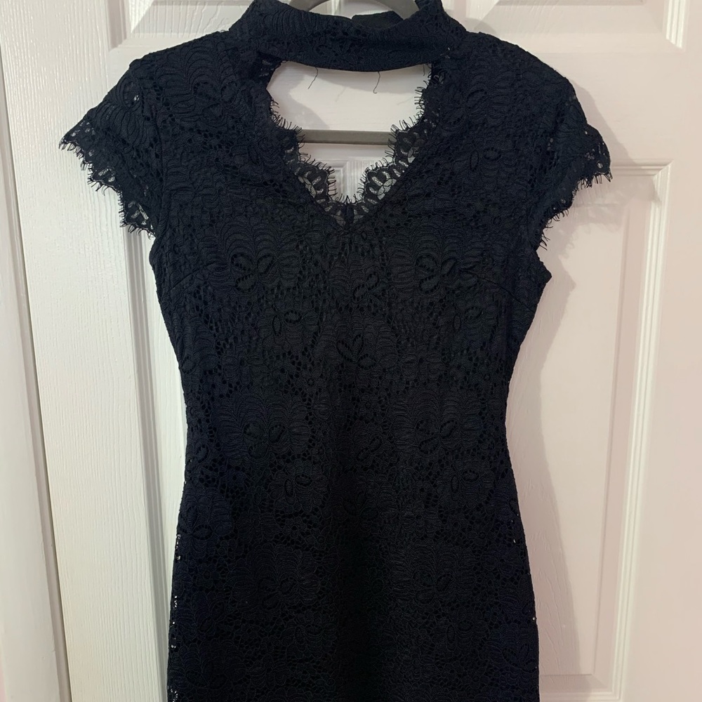Size small dress. Black lace all over the dress.Only worn once, good condition!